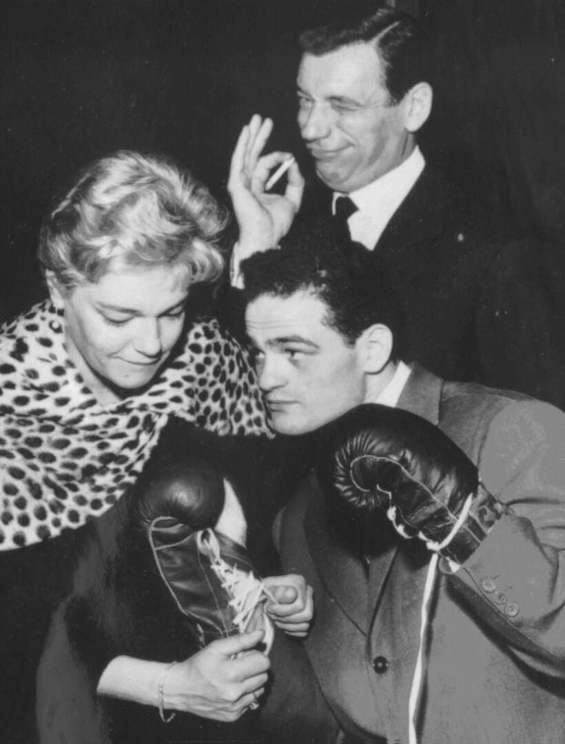 Yves Montand, his wife Simone Signoret and boxer Alphonse Halimi before the fight against Joe Beccera for the Bantamweight World Championships title.