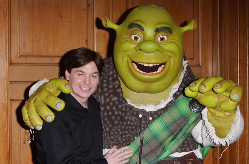 Mike Myers poses alongside Shrek after Shrek received official Scottish clan tartan.