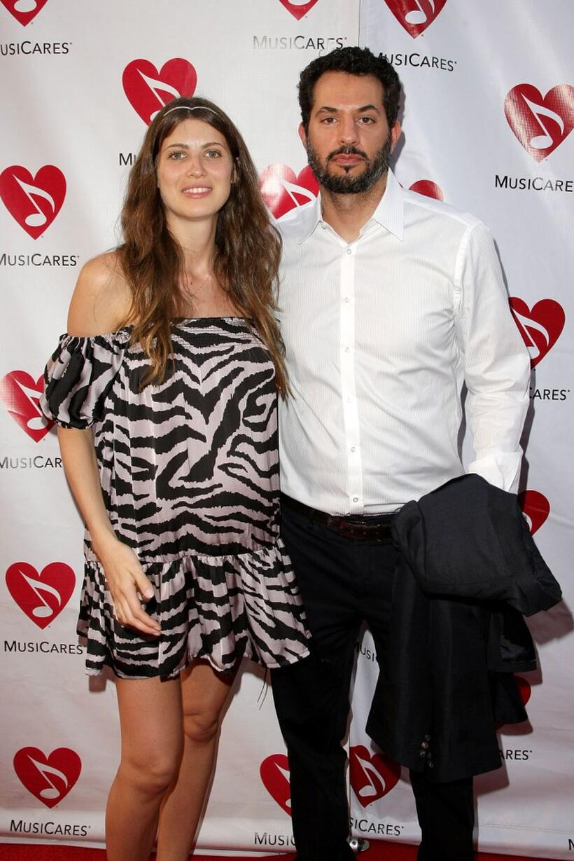 Guy Oseary and Guest at the 5th Annual MusiCares MAP Fund Benefit Concert.