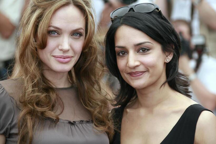 Angelina Jolie and Archie Panjabi at the photocall of "A Mighty Heart" during the 60th Cannes Film Festival.
