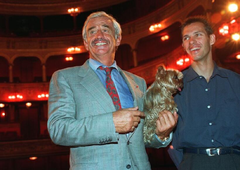 Jean-Paul Belmondo and his son Paul as he addresses Media in Paris.