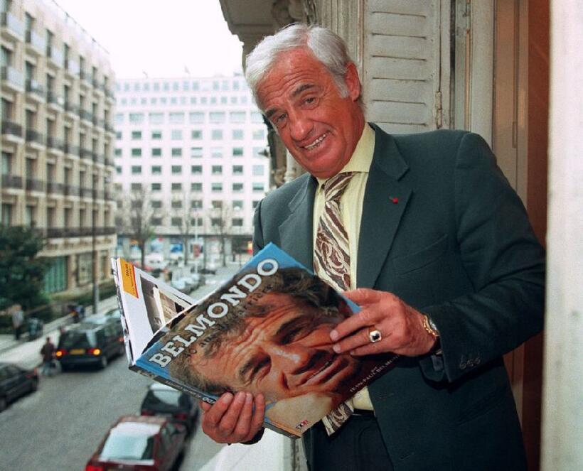 Jean-Paul Belmondo as he flips through his biography.