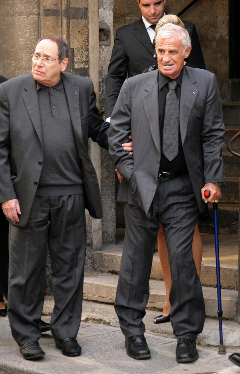 Jean-Paul Belmondo and Robert Hossein at the funeral of French actor and filmmaker Jean-Claude Brialy.