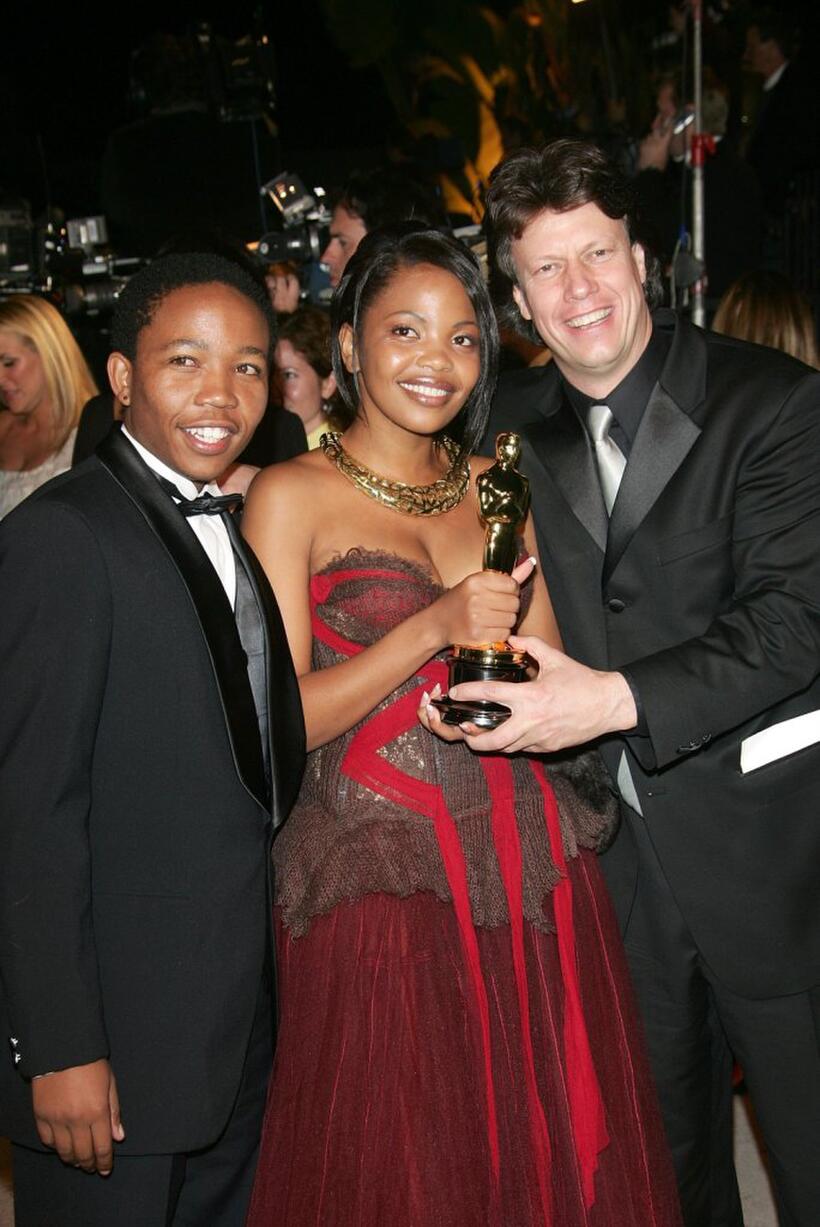 Presley Chweneyagae, Terry Pheto and Gavin Hood at the Vanity Fair Oscar Party.