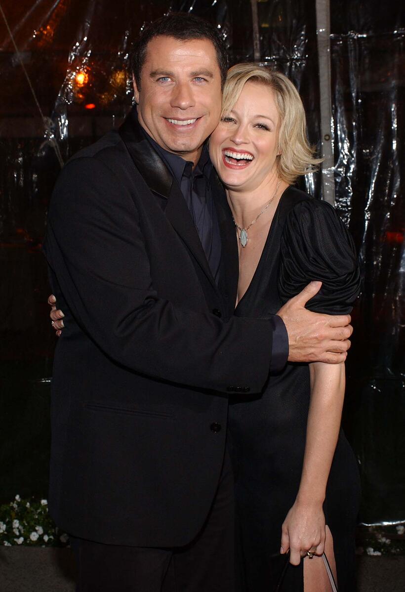 John Travolta and Teri Polo at the premiere of "Domestic Disturbance."