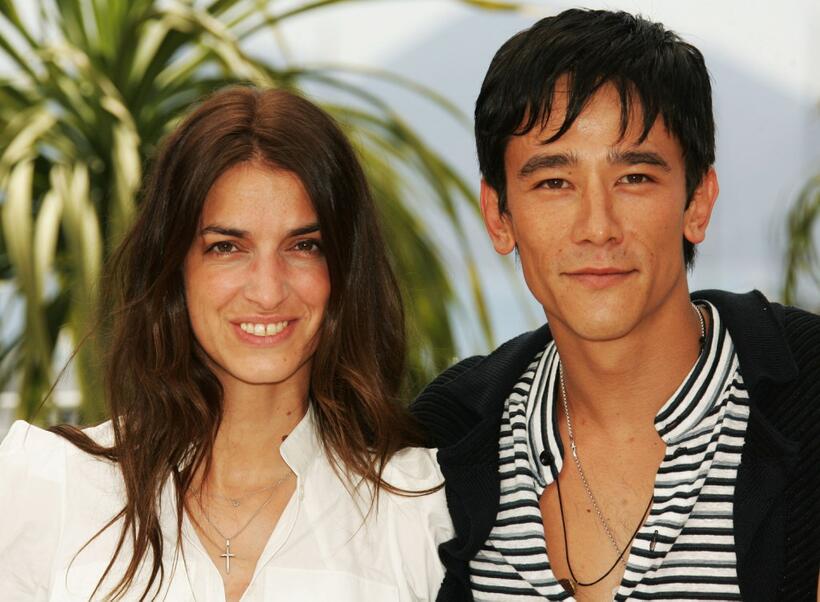 Joana Preiss and Carl Loong NG at the photocall of "Boarding Gate" during the 60th International Cannes Film Festival.