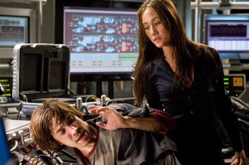 Deadly operative Mai (Maggie Q) threatens beleaguered hacker Matt Farrell (Justin Long) in "Live Free or Die Hard."