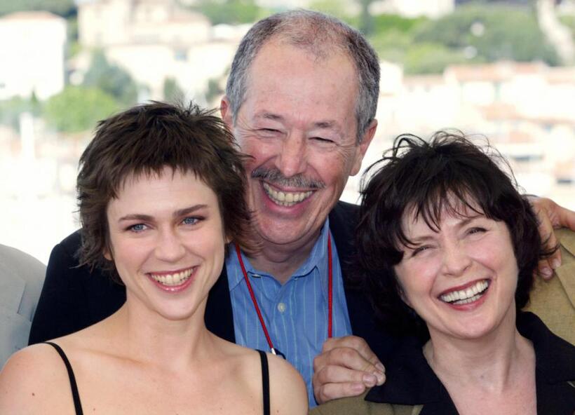 Marie-Josee Croze, Denys Arcand and Dorothee Berryman at the photocall of "Les Invasions barbares" during the 56th Cannes Film Festival.