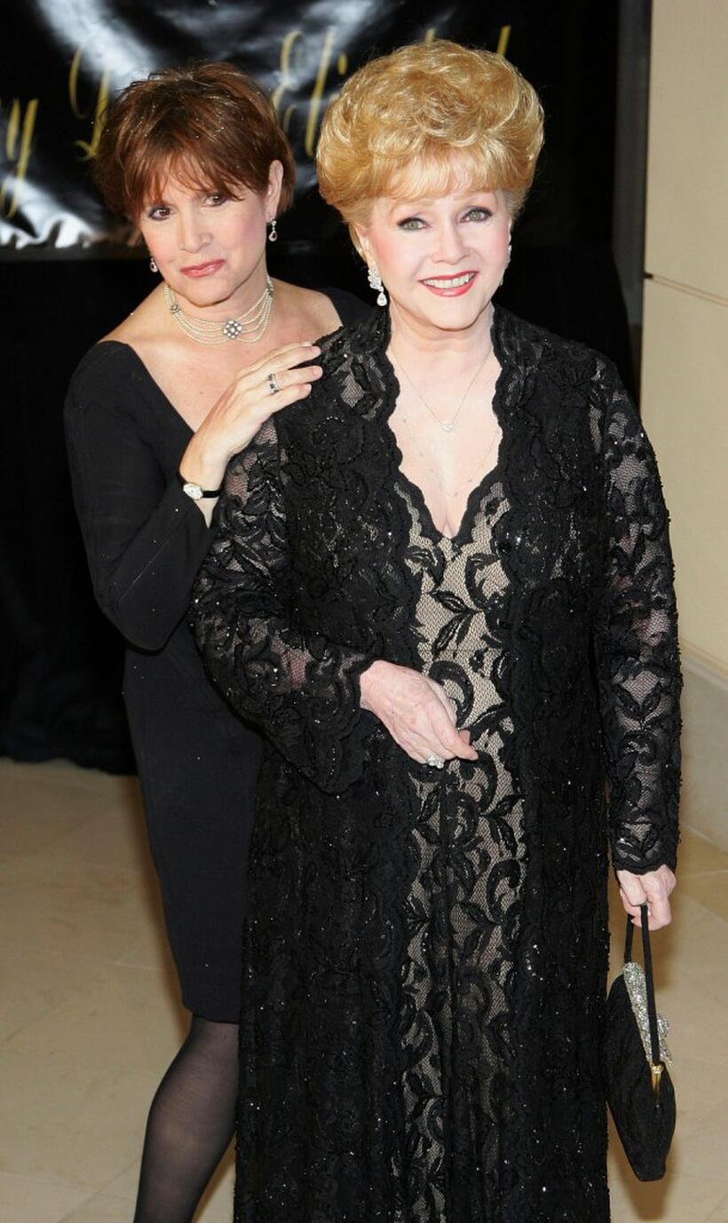 Debbie Reynolds and Carrie Fisher at the Dame Elizabeth Taylor's 75th birthday party.
