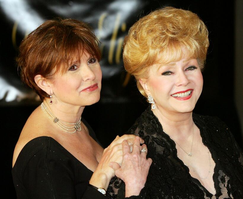 Debbie Reynolds and Carrie Fisher at the Dame Elizabeth Taylor's 75th birthday party.
