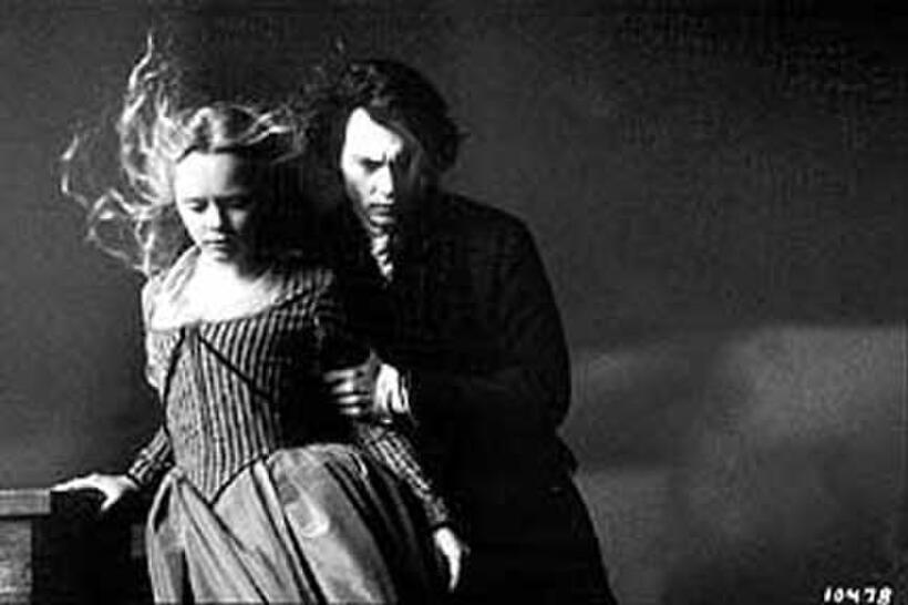 Christina Ricci as Katrina Van Tassel and Johnny Depp as Ichabod Crane in ``Sleepy Hollow.''