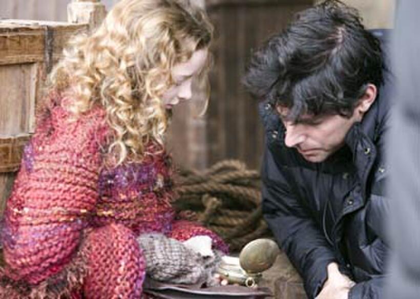 Dakota Blue Richards and director Chris Weitz on the set of "The Golden Compass."