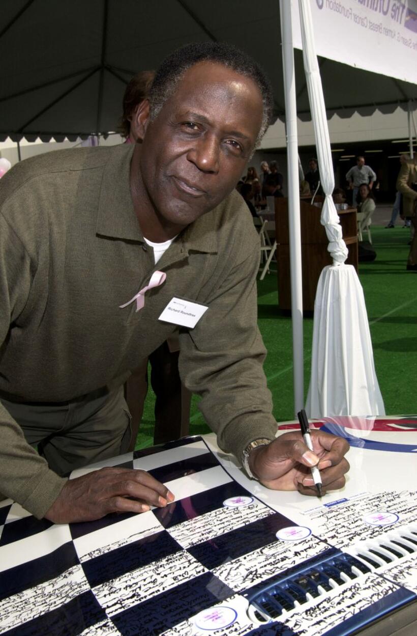 Richard Roundtree at the BMW Ultimate Drive, signs the BMW signature car.