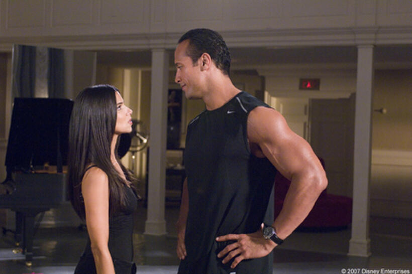 Roselyn Sanchez and The Rock in "The Game Plan."