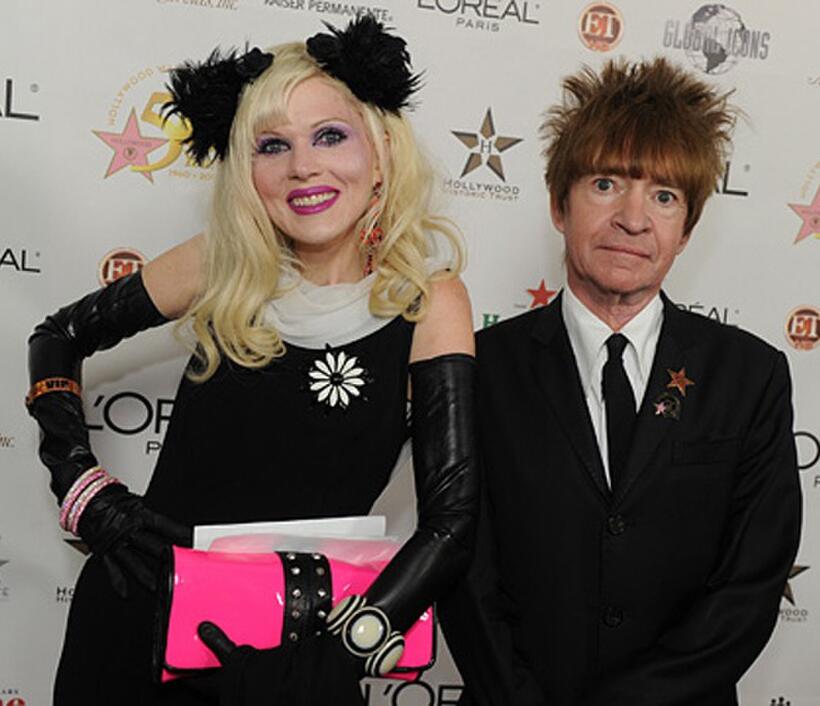 Rodney Bingenheimer and Guest at the 50th anniversary birthday bash of the Hollywood Walk of Fame.