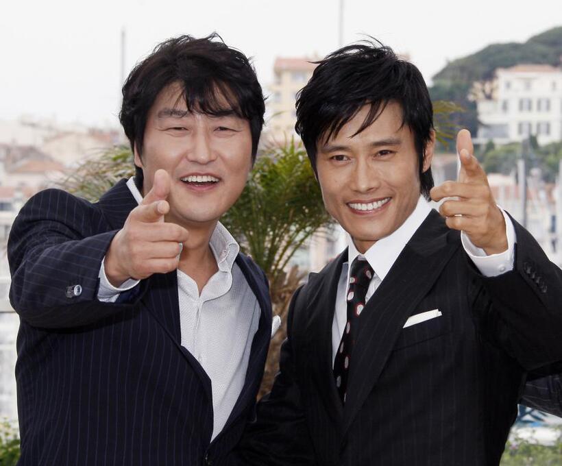 Song Kang-ho and Lee Byung-Hun at the photocall of "The Good, the Bad, the Weird" during the 61st International Cannes Film Festival.