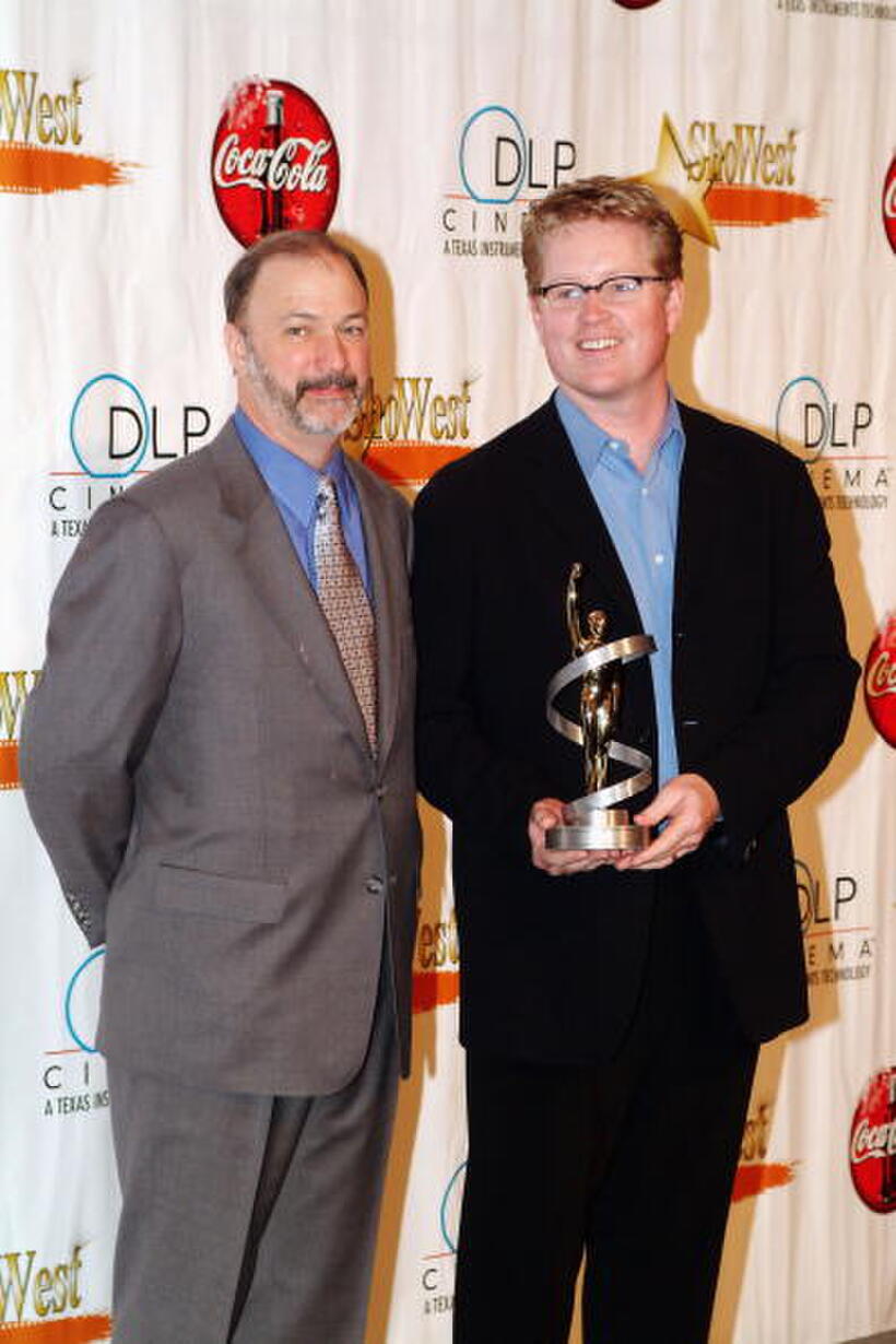 Rich Fay and Andrew Stanton at the final night banquet for ShoWest 2004.