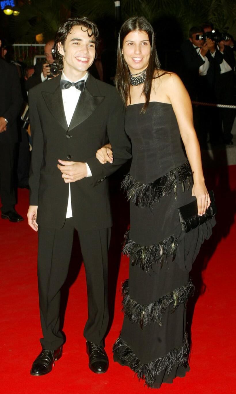 Caio Blat and Guest at the screening of "Carandiru" during the 56th International Cannes Film Festival.