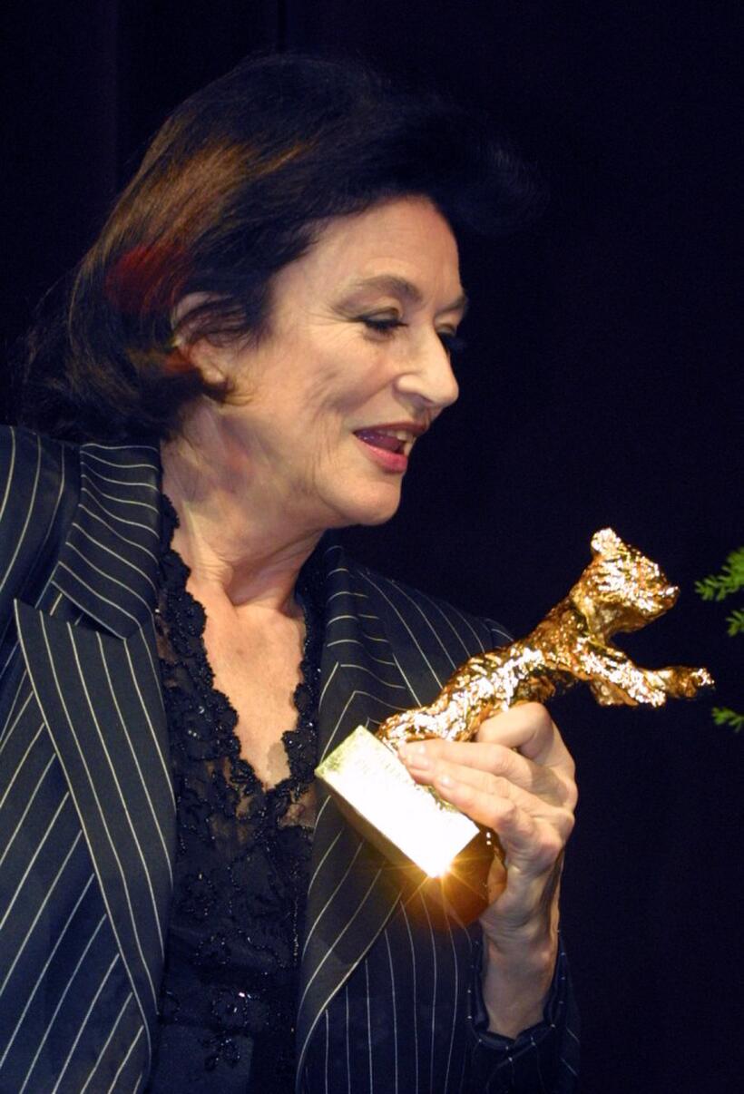 Anouk Aimee at the Berlinale Film Festival, clutches her Golden Bear Award for lifetime achievement.