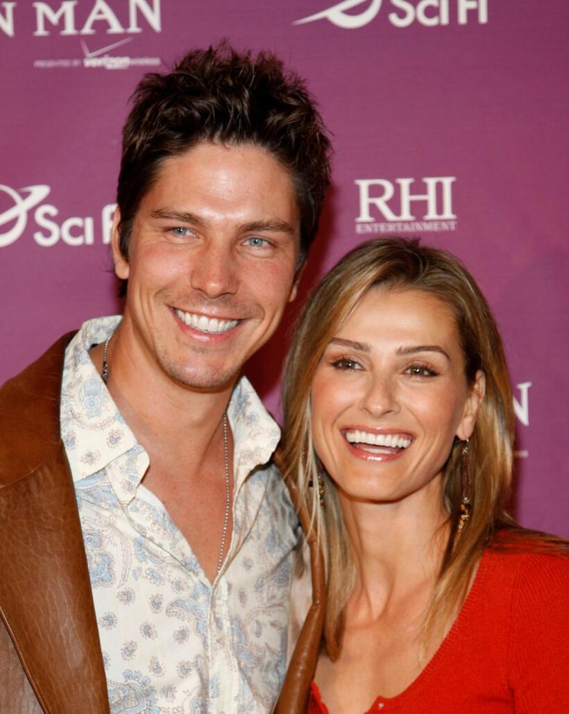 Michael Trucco and Sandra Hess at the Los Angeles premiere of "Tin Man."