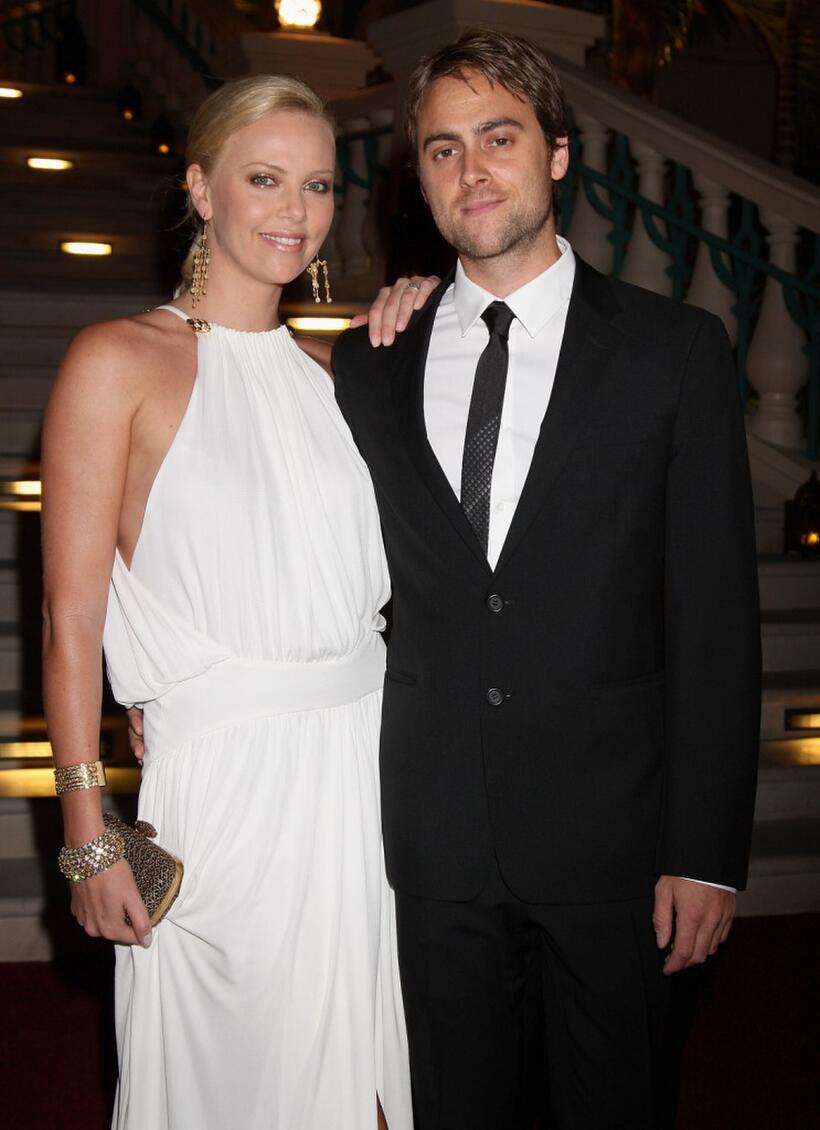 Charlize Theron and Stuart Townsend at the landmark Grand Opening of Atlantis, The Palm Resort, and the Palm Jumeirah.