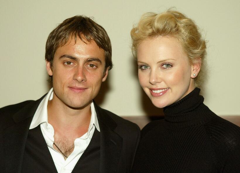 Stuart Townsend and his girlfriend Charlize Theron at the after-party of "Shade."
