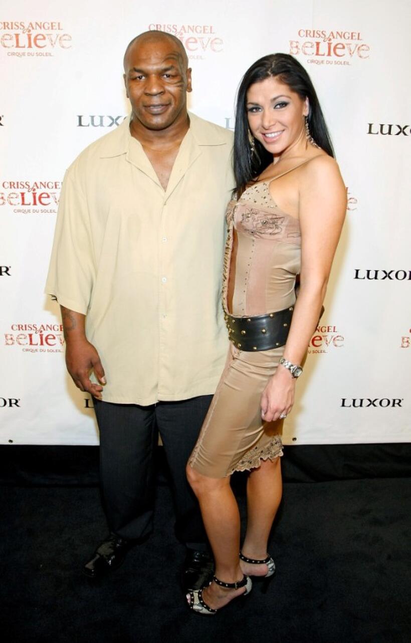 Mike Tyson and Guest at the gala premiere of "Criss Angel Believe."