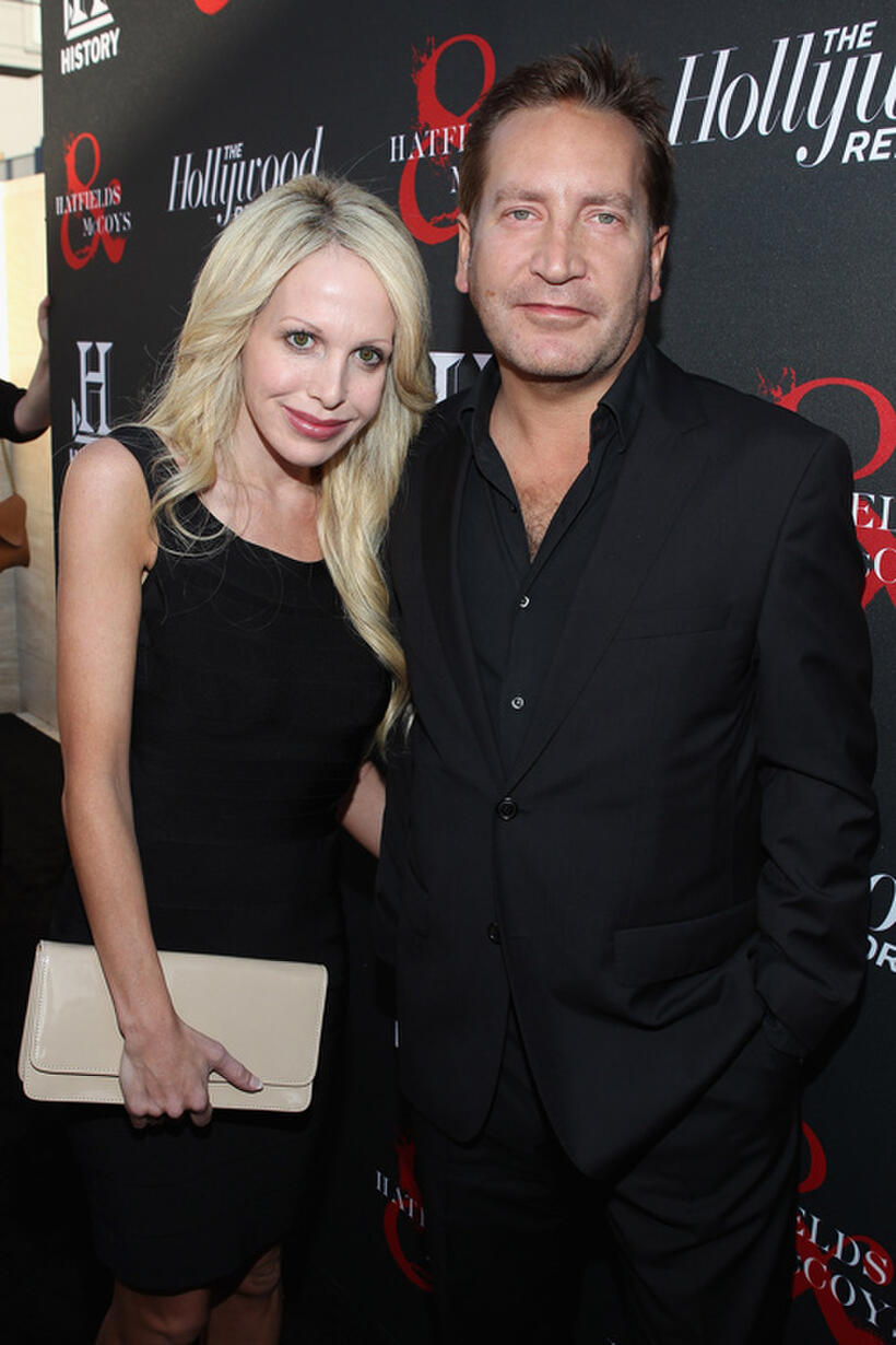 Ronan Vibert and Guest at the Hollywood Reporter & The History Channel premiere of "Hatfields & McCoys" in California.