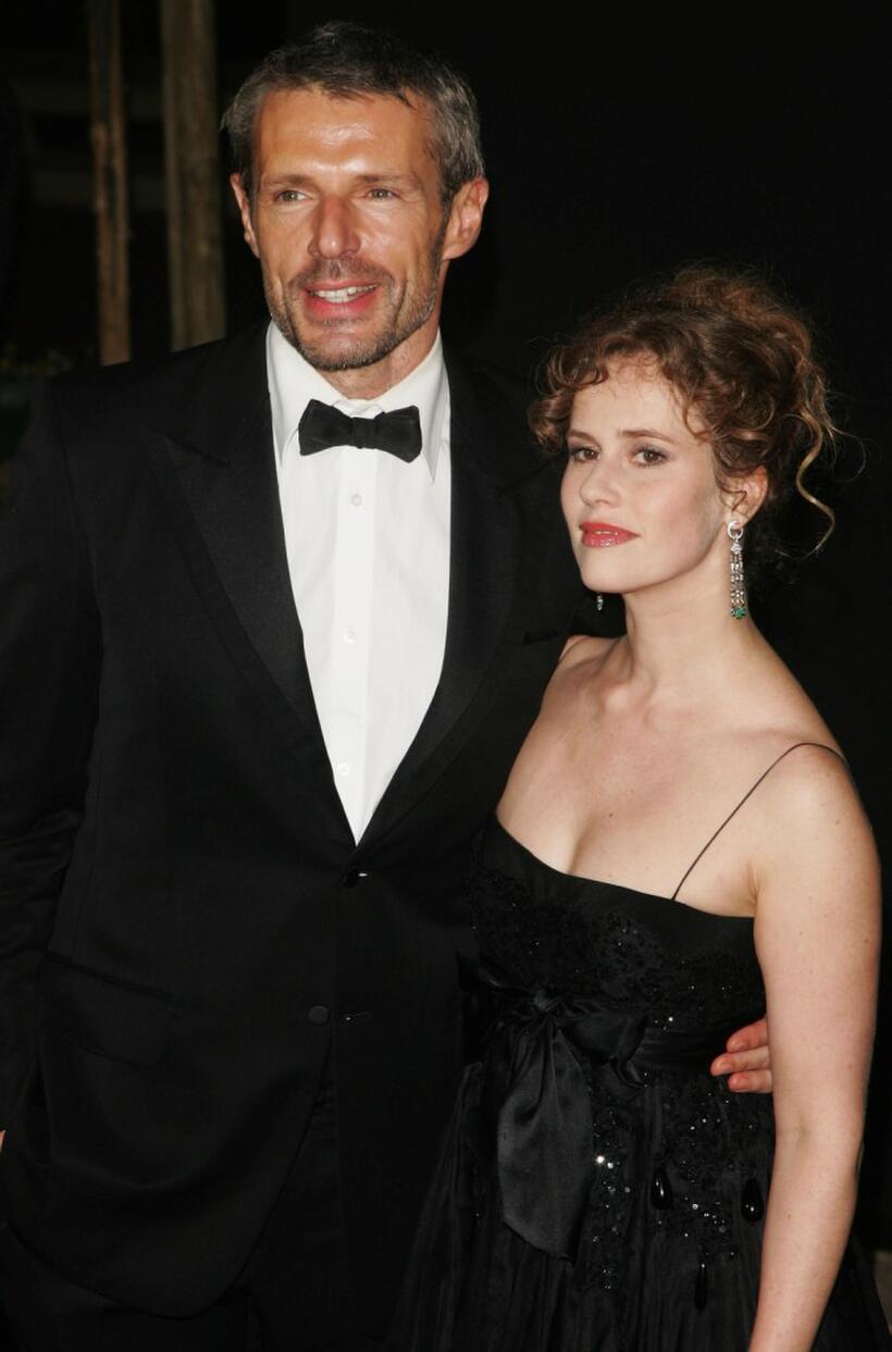 Lambert Wilson and guest at the Cannes Film Festival 60th Anniversary Dinner.