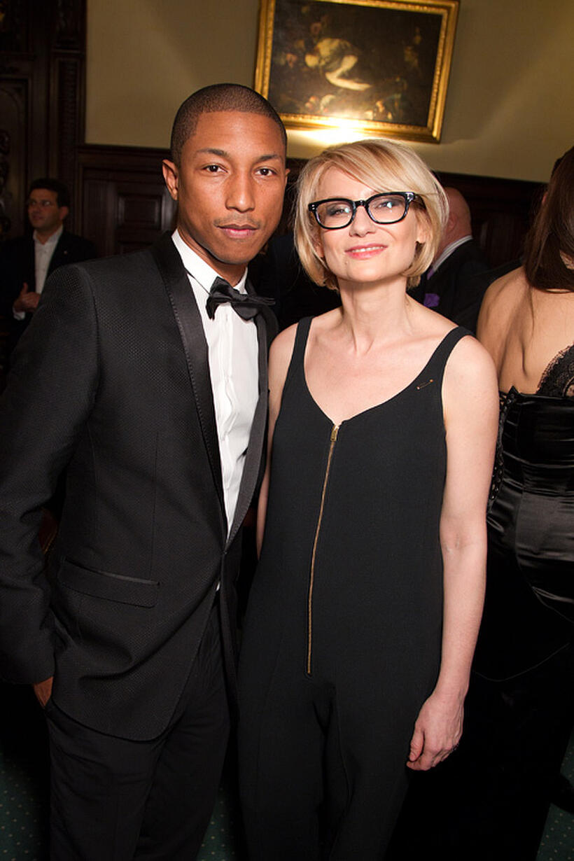 Pharrell Williams and Evelina Khromchenko at the Dolce & Gabbana and Martini dinner in Russia.