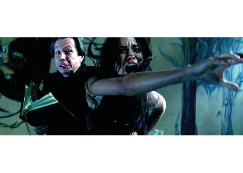 Gary Oldman as Rabbi Sendak and Odette Yustman as Casey Beldon in "The Unborn."