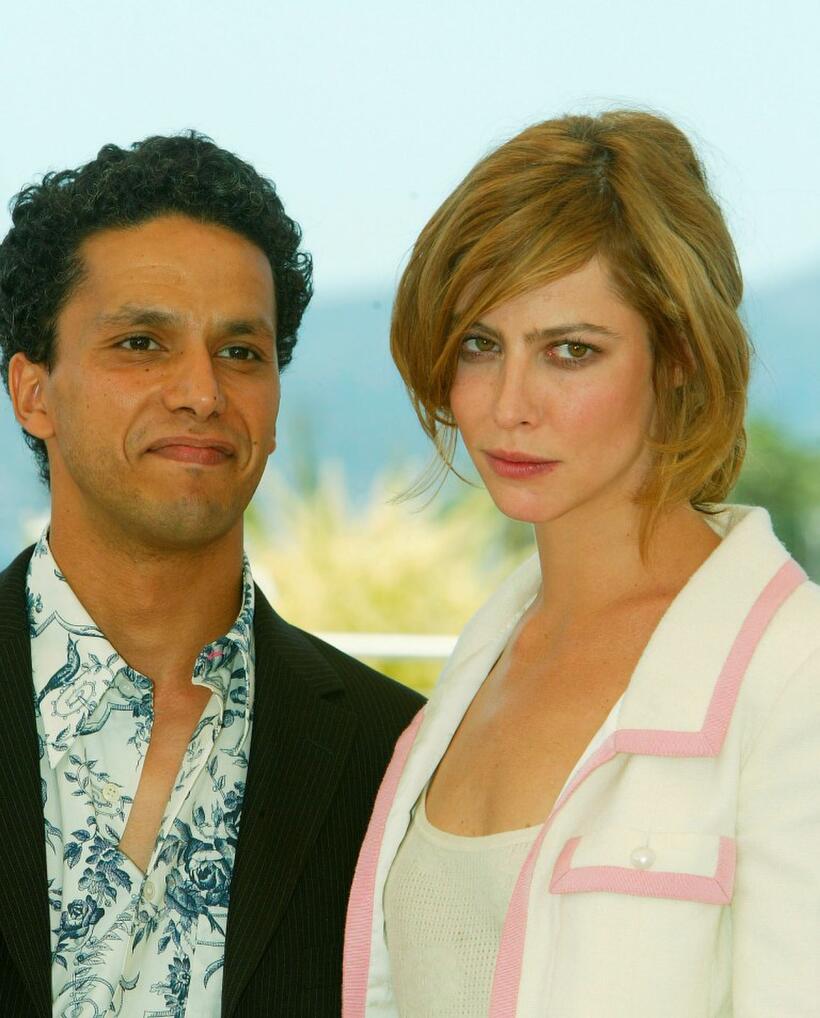 Sami Bouajila and Anna Mouglalis at the photocall of "En Jouant Dans La Compagnie Des Hommes" at Palais des Festivals during the 56th International Cannes Film Festival.