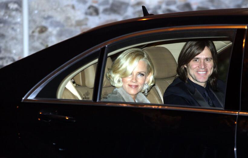 Jim Carrey and Jenny McCarthy at the wedding of Katie Holmes and Tom Cruise.