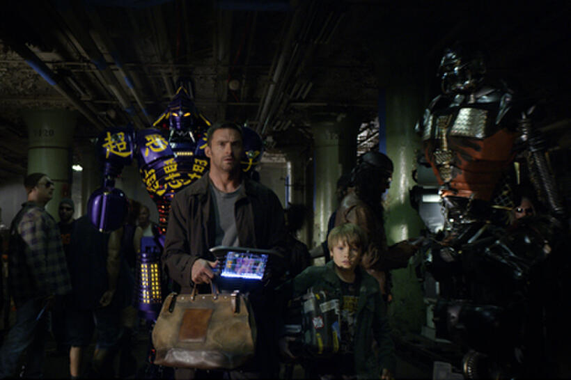 Hugh Jackman as Charlie Kenton and Dakota Goyo as Max in ``Real Steel.''