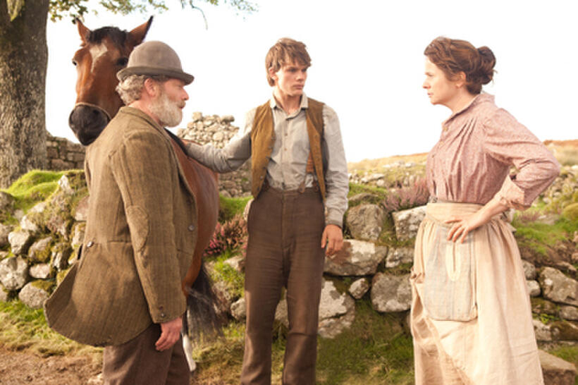 Peter Mullan as Ted Narracott, Jeremy Irvine as Albert and Emily Watson as Rosie Narracott in ``War Horse.''