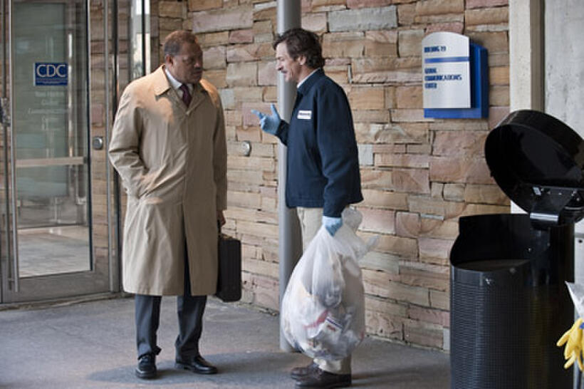 Laurence Fishburne as Dr. Ellis Cheever and John Hines in ``Contagion.''