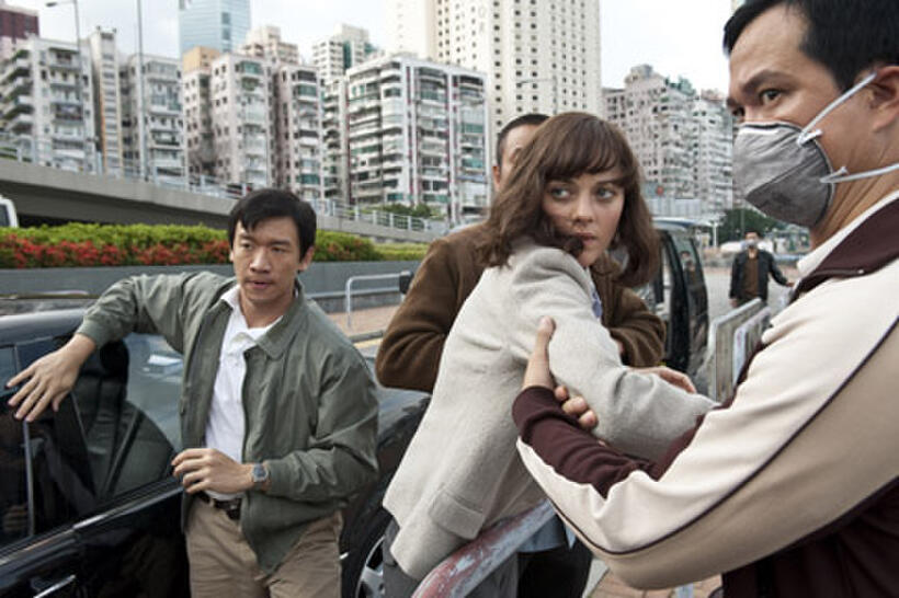 Chin Han as Sun Feng and Marion Cotillard as Dr. Leonora Orantes in ``Contagion.''
