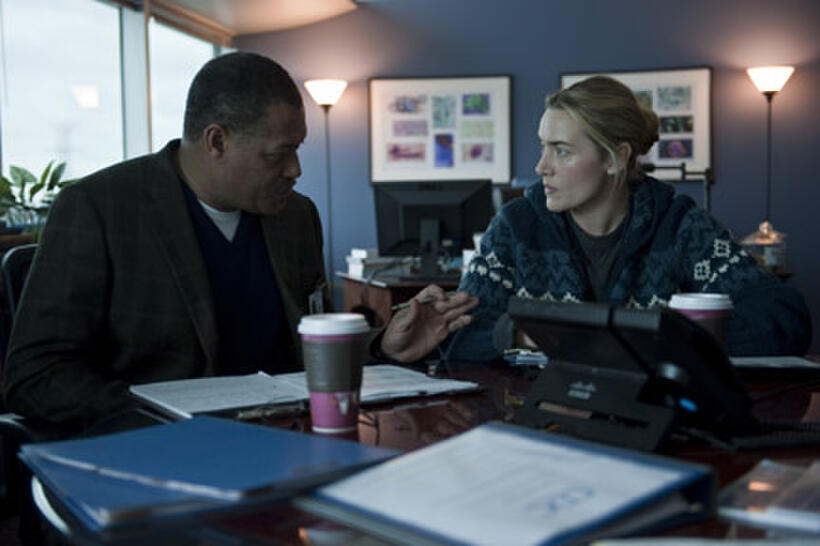 Laurence Fishburne as Dr. Ellis Cheever and Kate Winslet as Dr. Erin Mears in ``Contagion.''