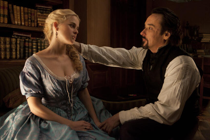 Alice Eve as Emily Hamilton and John Cusack as Edgar Allan Poe in ``The Raven.''