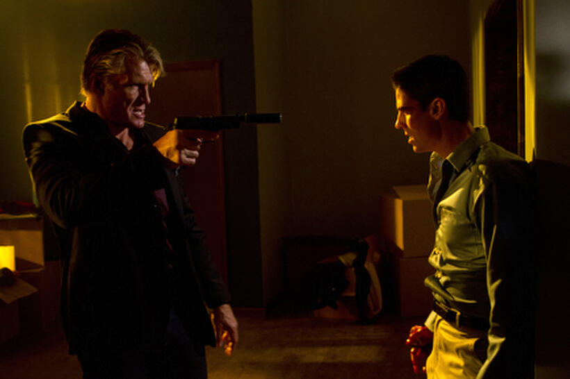 Dolph Lundgren as Andy Spector and Sean Faris as David Nash in ``Stash House.''