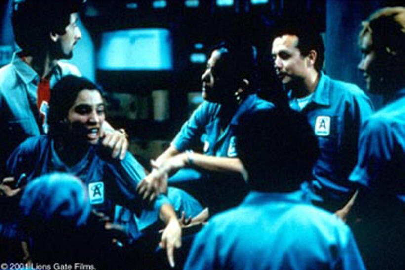 SAM, MAYA and FELLOW JANITORS (ADRIEN BRODY and PILAR PADILLA).