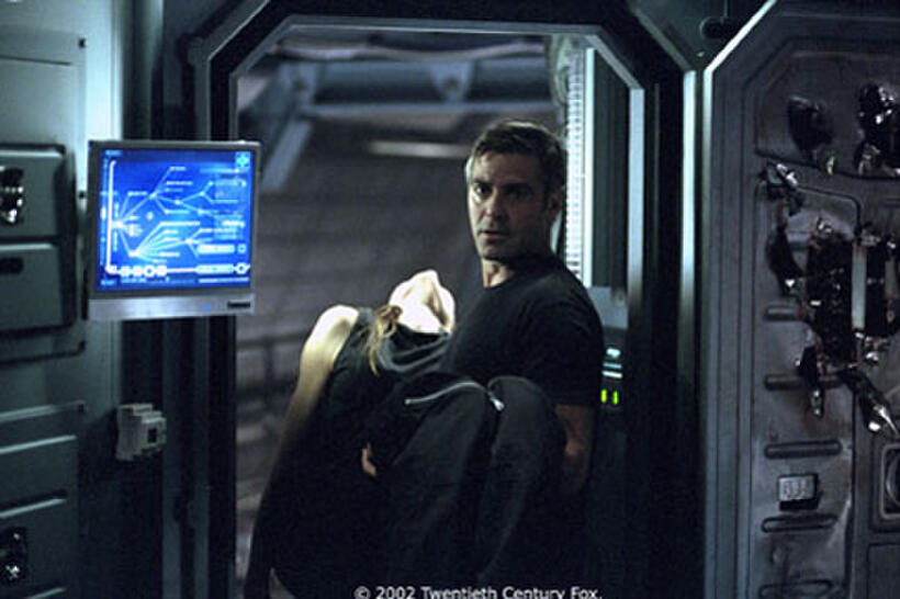 Kelvin (George Clooney) takes desperate measures following the sudden appearance of his wife Rheya (Natascha McElhone).