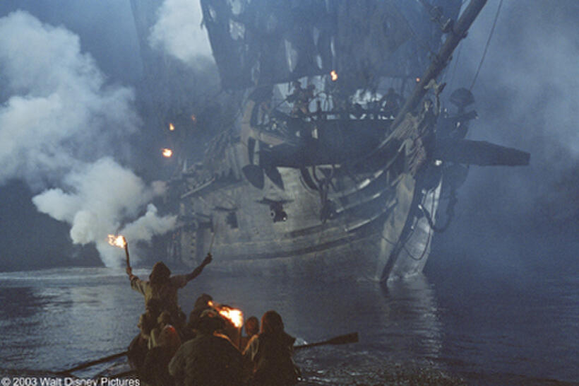The Black Pearl, the notorious 'ghost ship,' looms on the dark ocean in "Pirates of the Caribbean: The Curse of the Black Pearl."