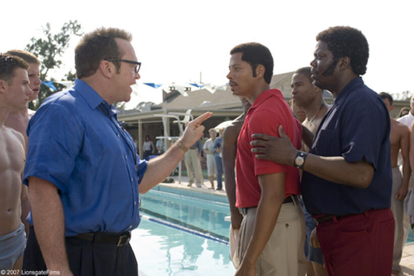 The opponent's coach (Tom Arnold) confronts Jim Ellis (Terrence Howard) and Elston (Bernie Mac) in "Pride."