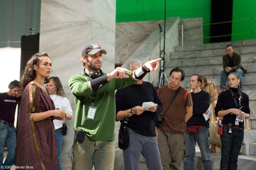 Director Zack Snyder blocks a scene with Lena Headey on the set of the film "300."