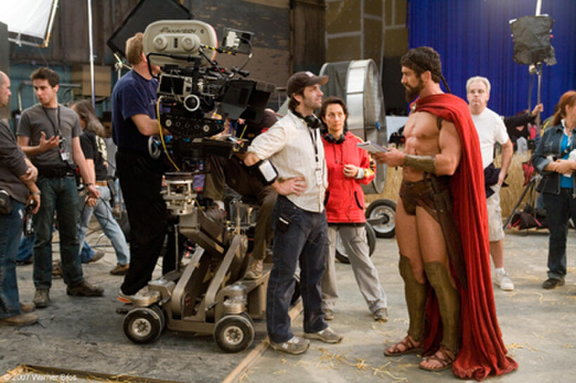 Director Zack Snyder and Gerard Butler discuss a scene on the set of the film "300."