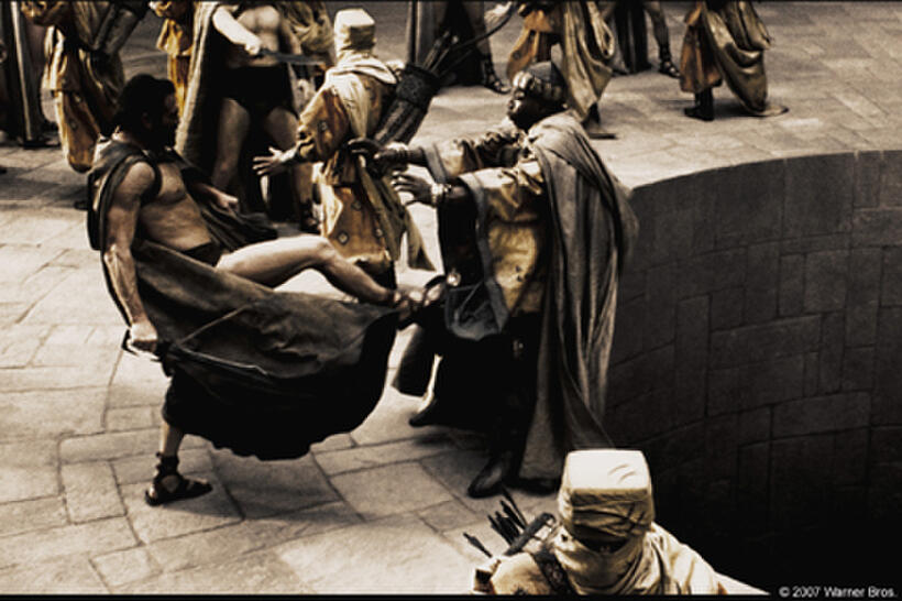 Leonidas (Gerard Butler) personally delivers his answer to the Persian Messenger (Peter Mensah) in "300."
