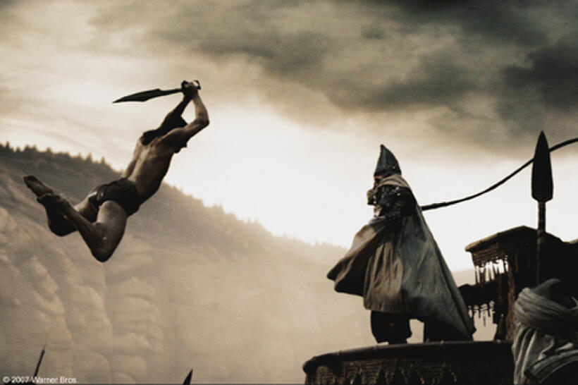 Stelios (Michael Fassbender) leaps over several guards to counter the attack of the Persian emissary (Tyrone Benskin) in "300."