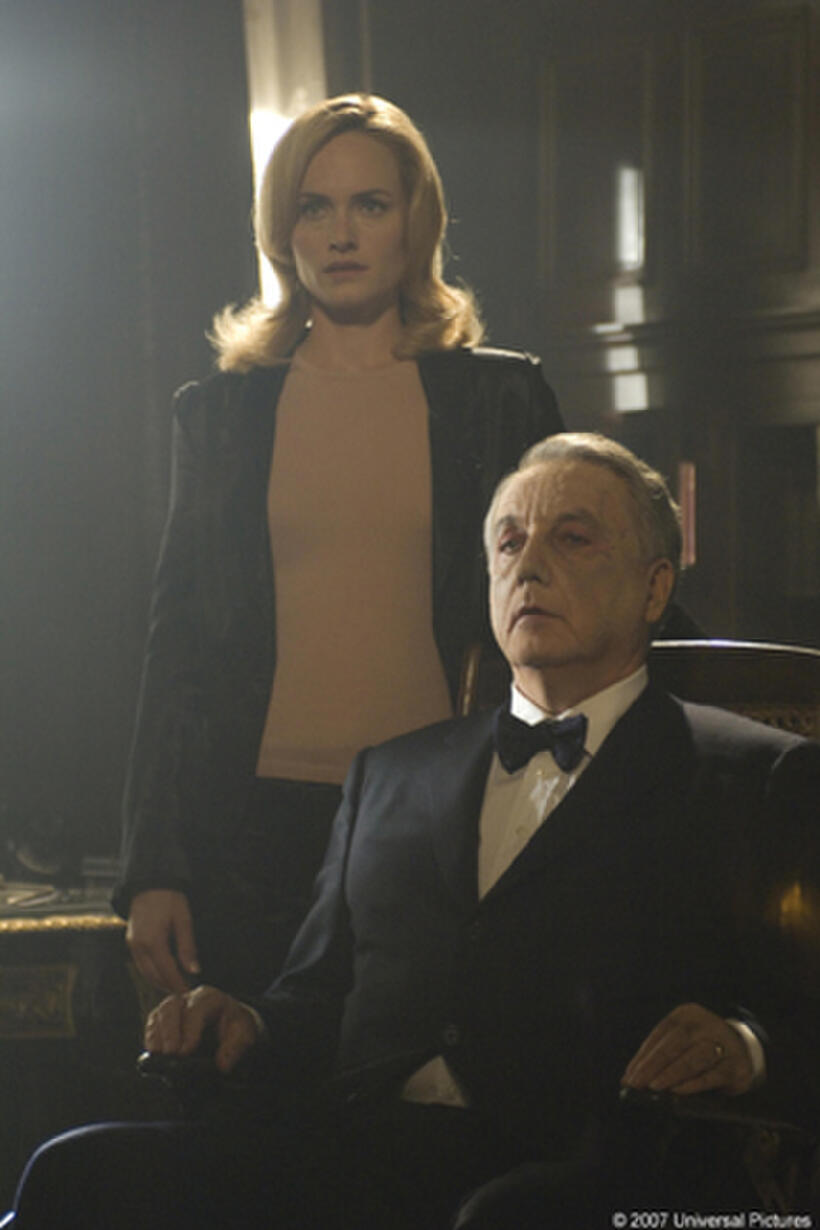 Ella (Amber Valletta) and her husband, Edward (Bob Gunton), greet returning family members in "Dead Silence."