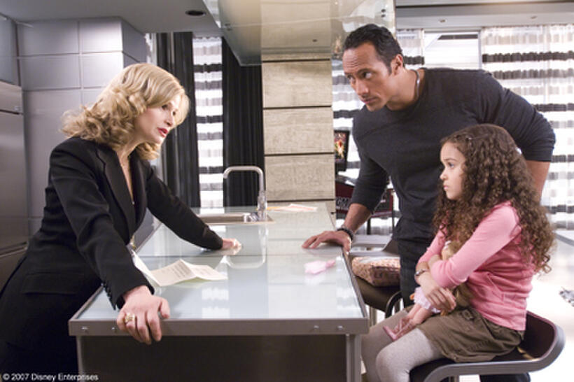 Kyra Sedgwick, The Rock and Madison Pettis in "The Game Plan."